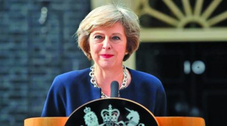 May defends Brexit delay, critic asks her to resign