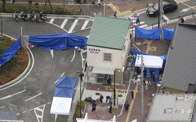 Japan arrests man for stabbing police officer, taking gun