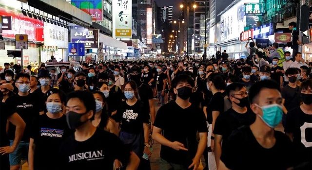 Hong Kong protesters appear in court to face “riot” charge