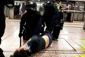 Hong Kong police storm metro system after protests
