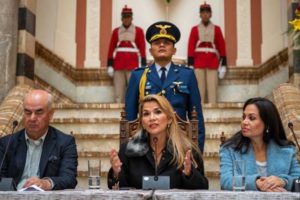 In Bolivia, interim leader sets conservative, religious tone