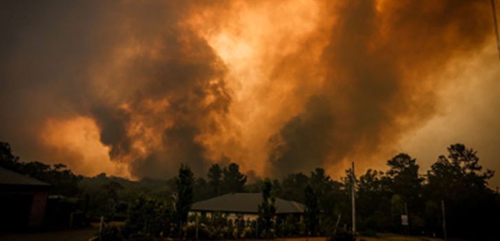 Australia PM rejects cuts to coal as fires rage