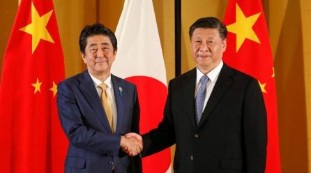 As world gets tough on China, Japan treads cautiously