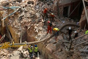 Rescuers sift Beirut rubble amid signs of life a month after blast