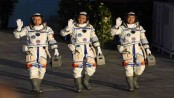 China launches first three-man crew to new space station