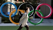 Japan to widen virus emergency after record spike amid Olympics