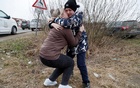 At Ukraine border, a mother brings a stranger’s children to safety