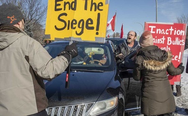 Canada opens blockaded bridge, but in Ottawa, truckers won’t budge