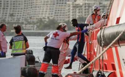 Rescuers save 86 migrants from boat near Canary Islands